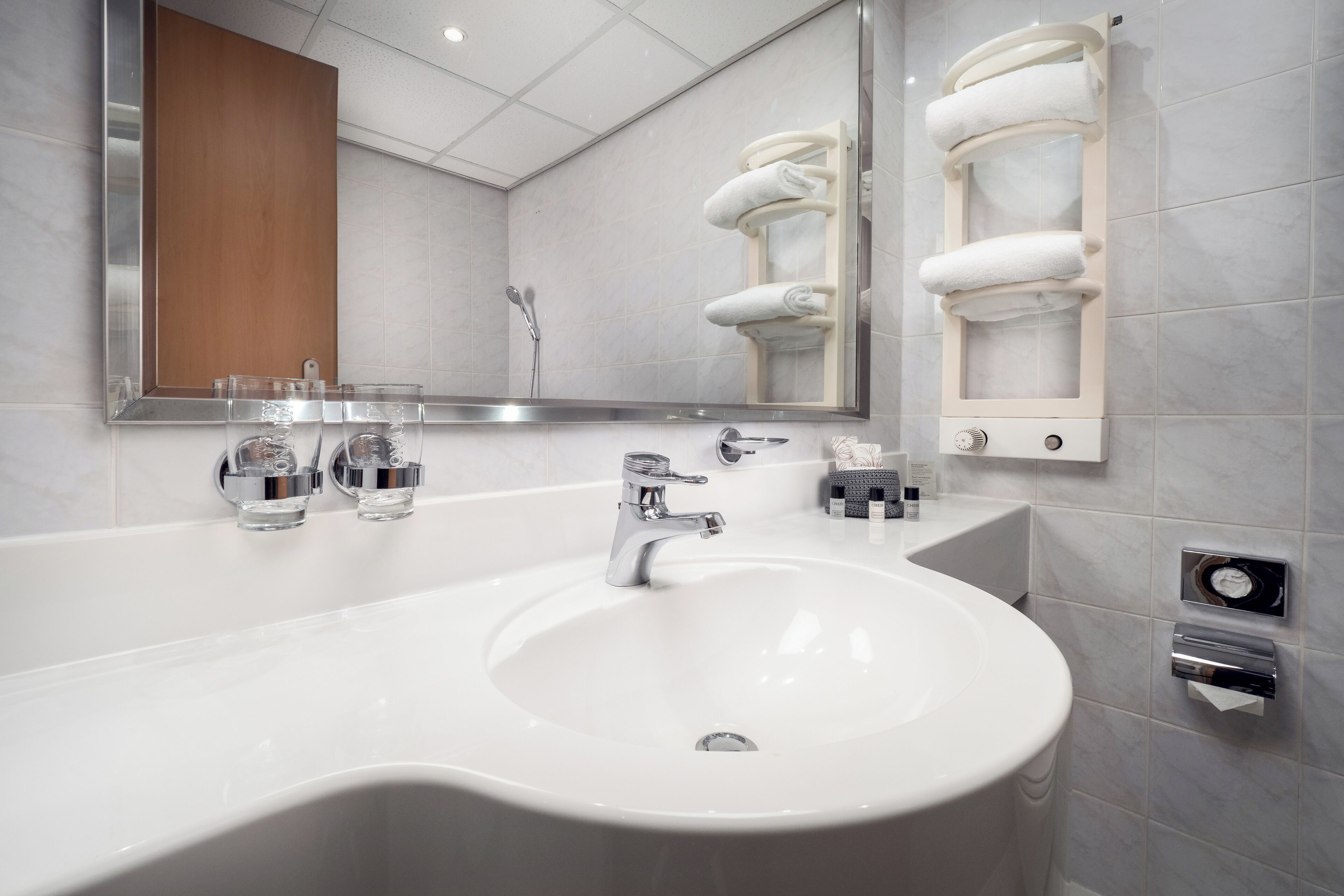 hair dryer, slippers, towels, soap