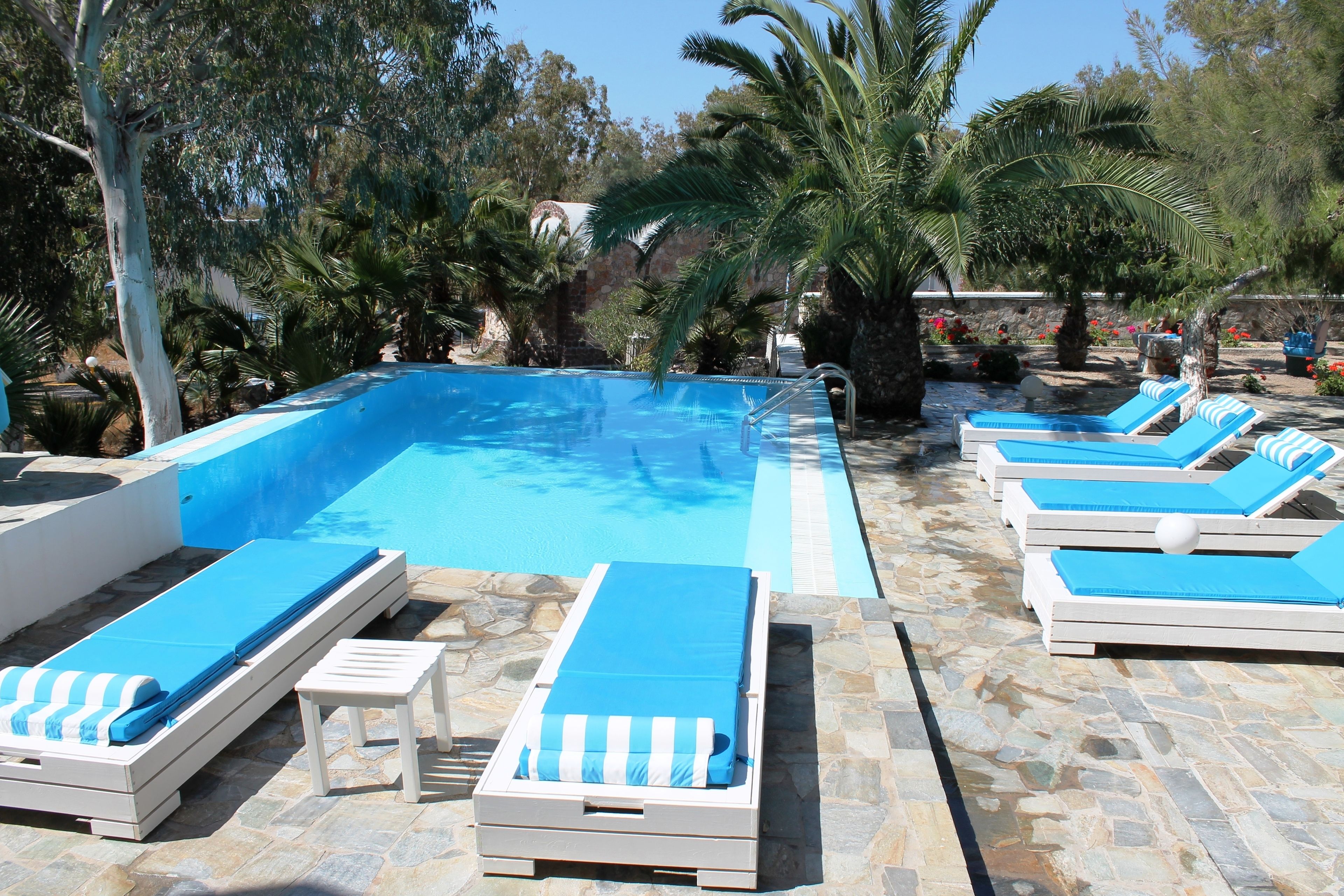 Outdoor pool, pool umbrellas, pool loungers