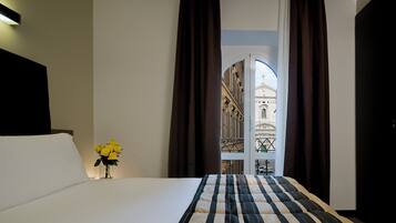 Triple Room | Minibar, in-room safe, desk, blackout curtains