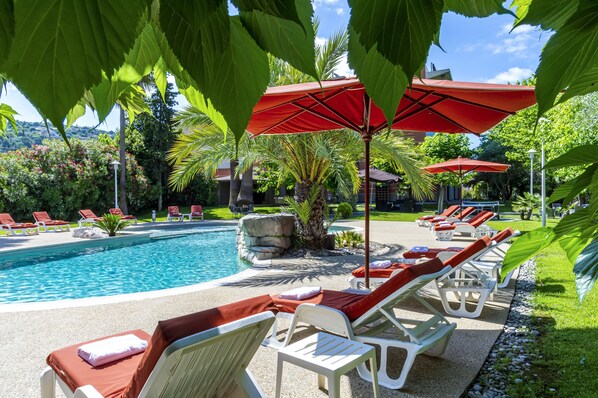 Seasonal outdoor pool, pool umbrellas, pool loungers