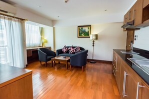 Suite, 1 Bedroom | Living area | Flat-screen TV, DVD player - Atlas Sukhumvit (Bangkok)