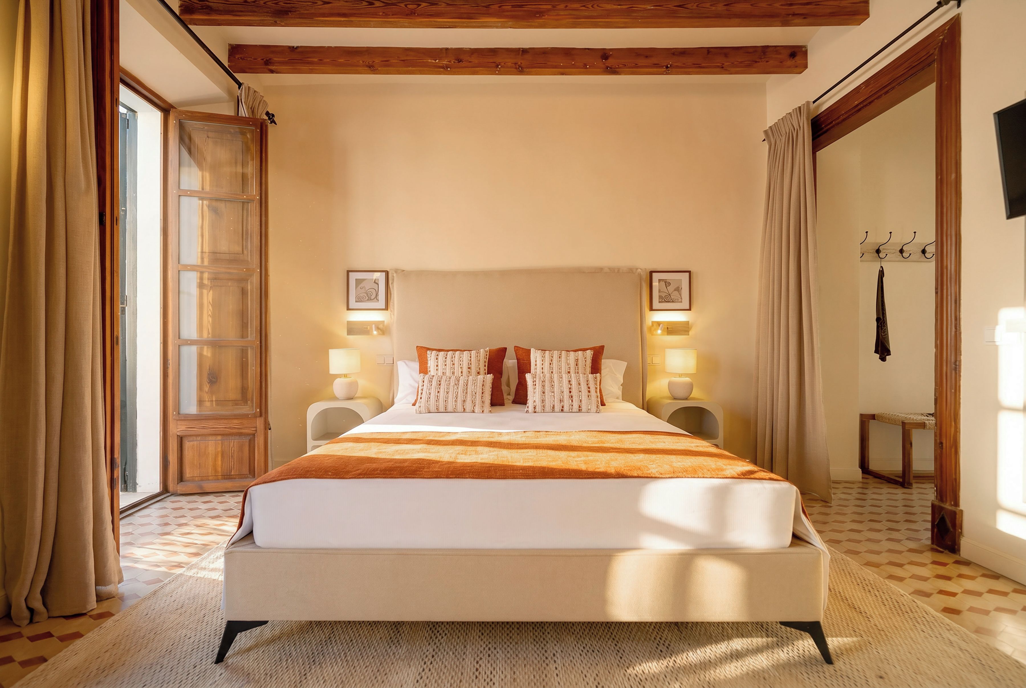 A bedroom with a large bed, two bedside tables with lamps, a wooden ceiling, and a checkered floor.