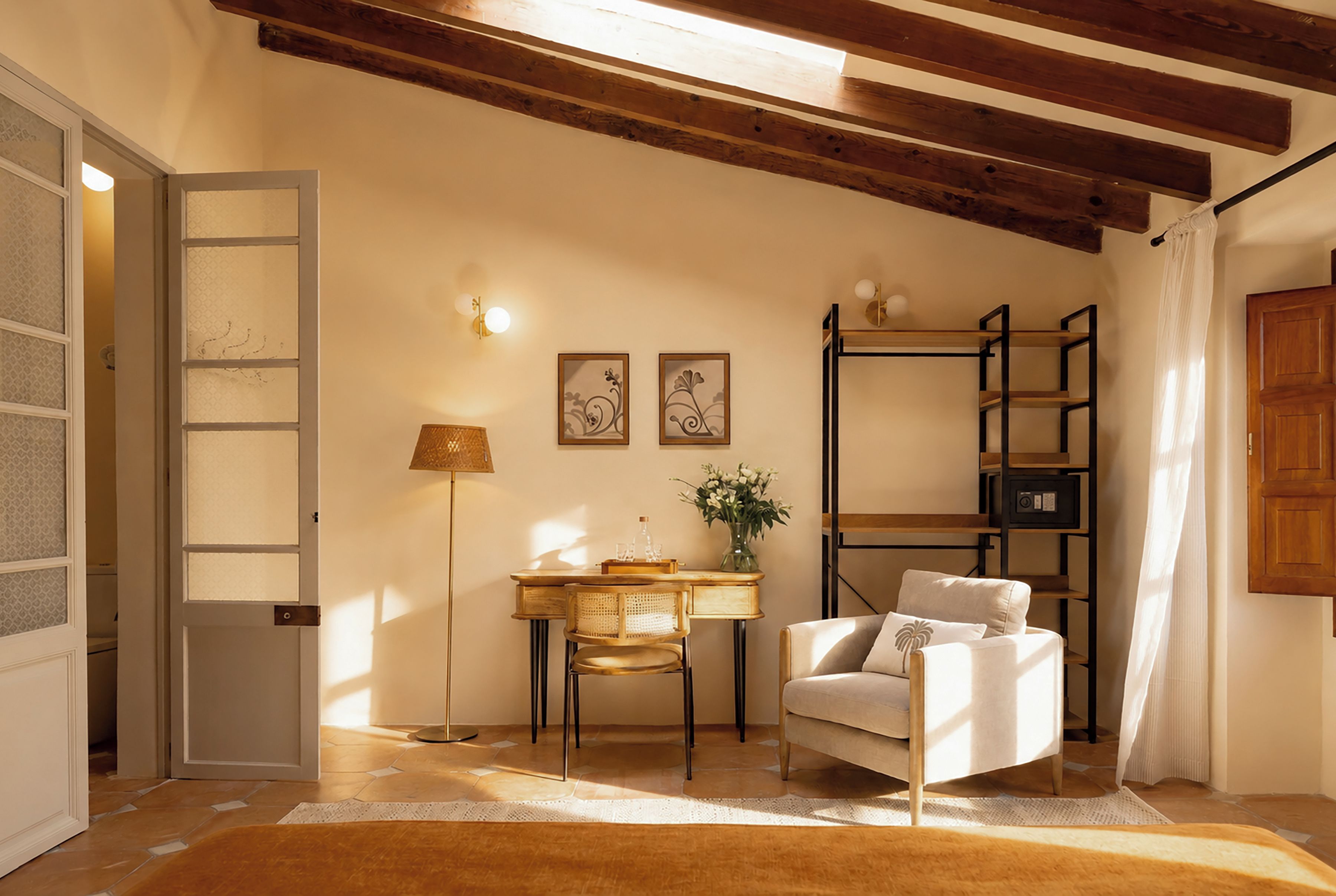 A room with a wooden ceiling, a white chair, a desk with a lamp, and a bookshelf.