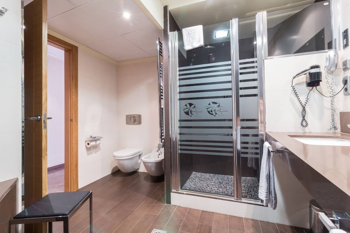junior suite, jetted tub | bathroom | hair dryer, towels