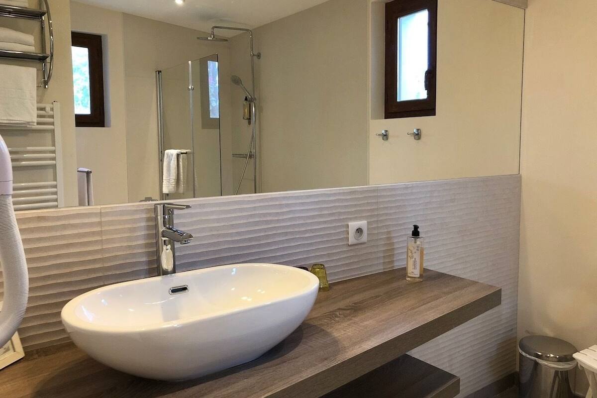 superior room | bathroom | rainfall showerhead, hair dryer, towels