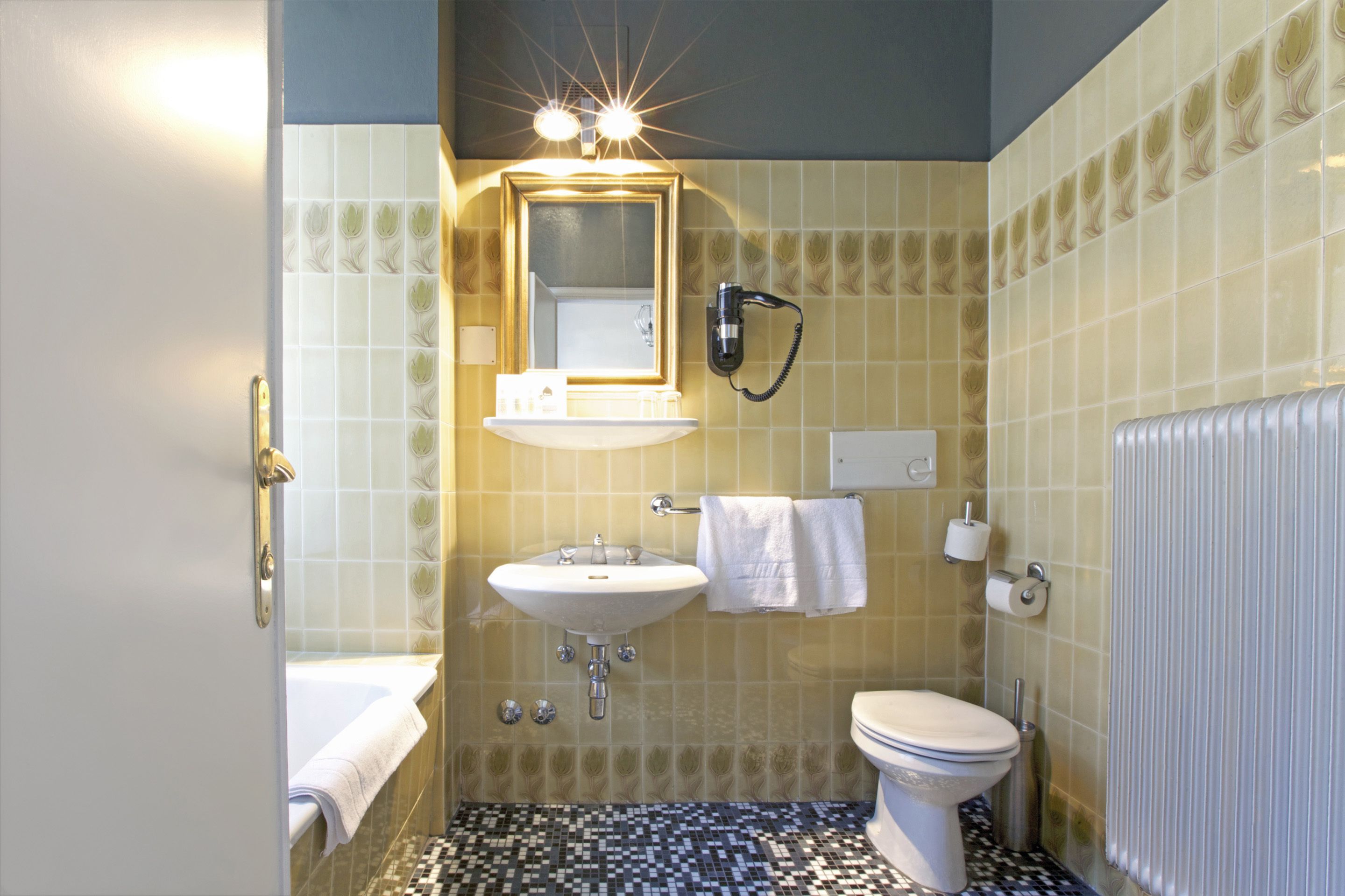 designer toiletries, hair dryer, towels