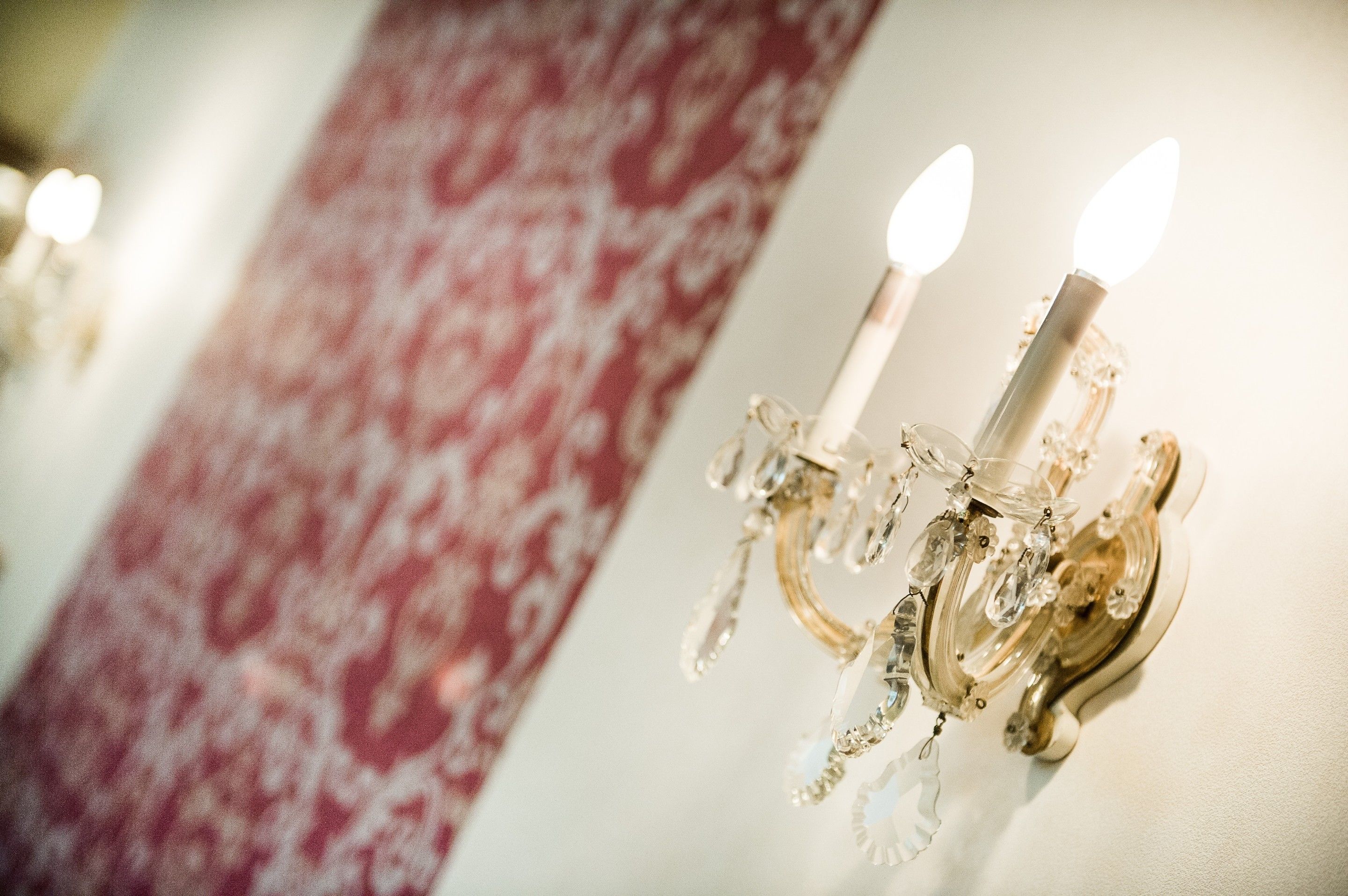 A chandelier with multiple lights and crystal decorations.