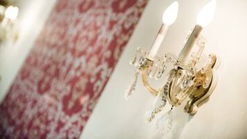 A chandelier with multiple lights and crystal decorations.