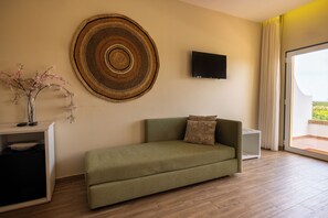 Superior Family Room | Minibar, in-room safe, individually decorated, desk