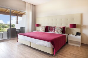 Junior Suite | Minibar, in-room safe, individually decorated, desk