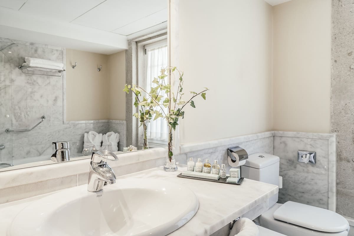 eco-friendly toiletries, hair dryer, slippers, towels