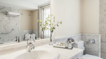 Eco-friendly toiletries, hair dryer, slippers, towels