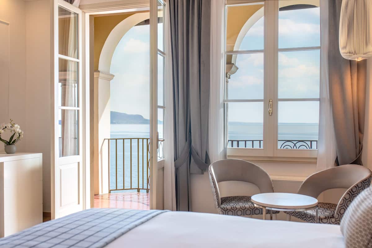 deluxe room, lake view with balcony or garden access | lake view