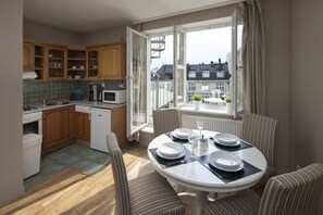 Family Apartment, 1 Bedroom, Kitchen | In-room dining