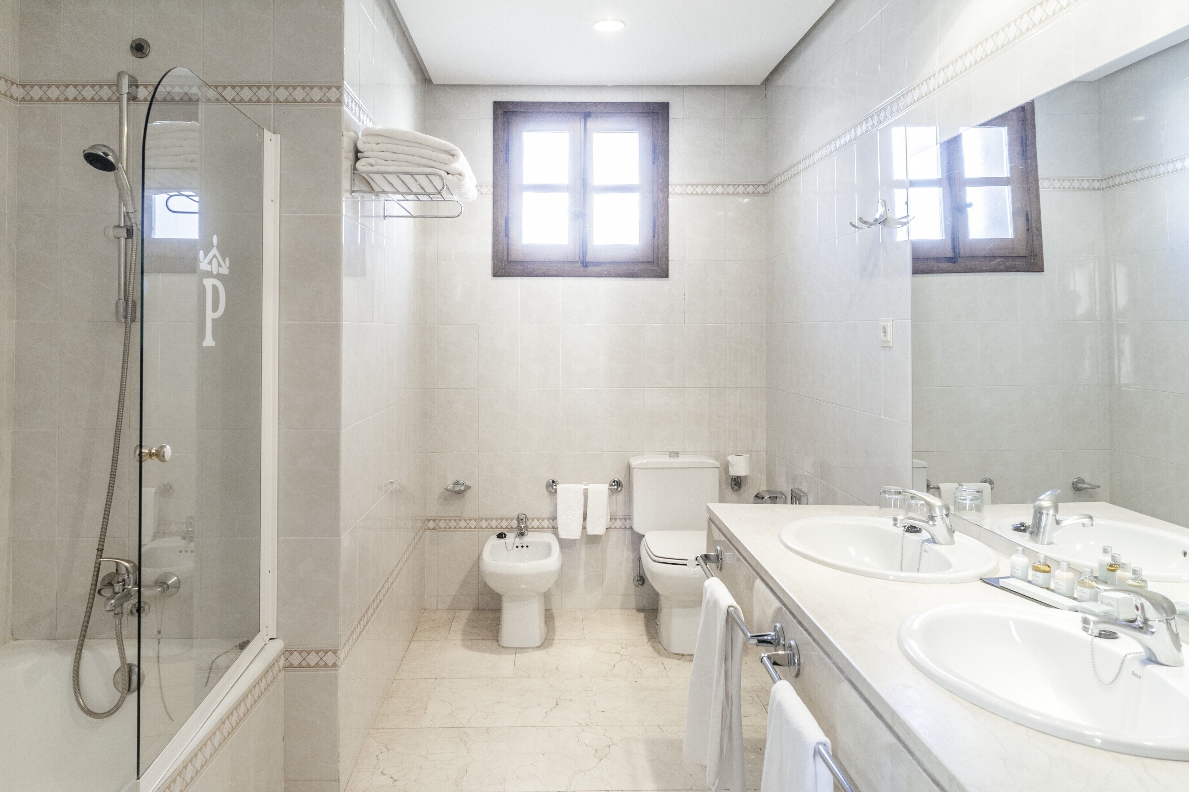 eco-friendly toiletries, hair dryer, bidet, towels