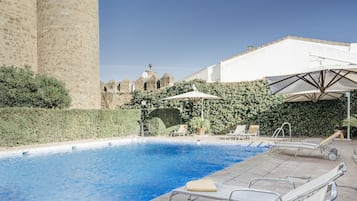 Seasonal outdoor pool, open 11:00 AM to 9:00 PM, pool umbrellas