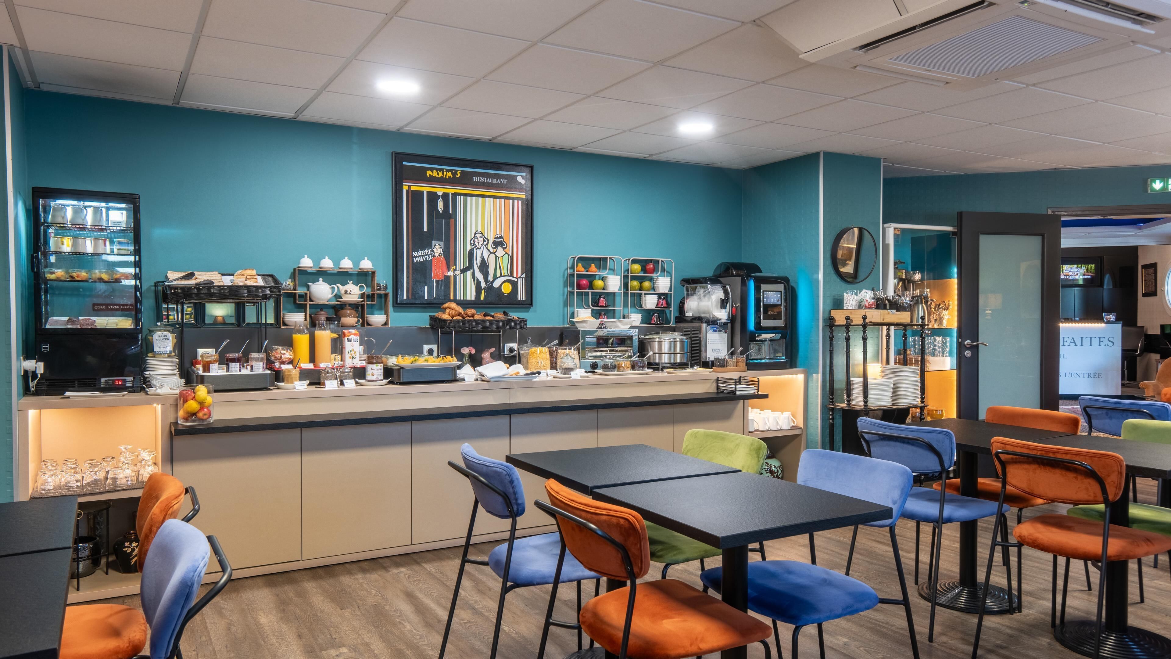 A breakfast bar with a variety of food items and a coffee machine. There are chairs and tables arranged for seating.