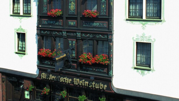 A traditional European building with multiple windows and flower boxes. - Altdeutsche Weinstube (Ruedesheim am Rhein)