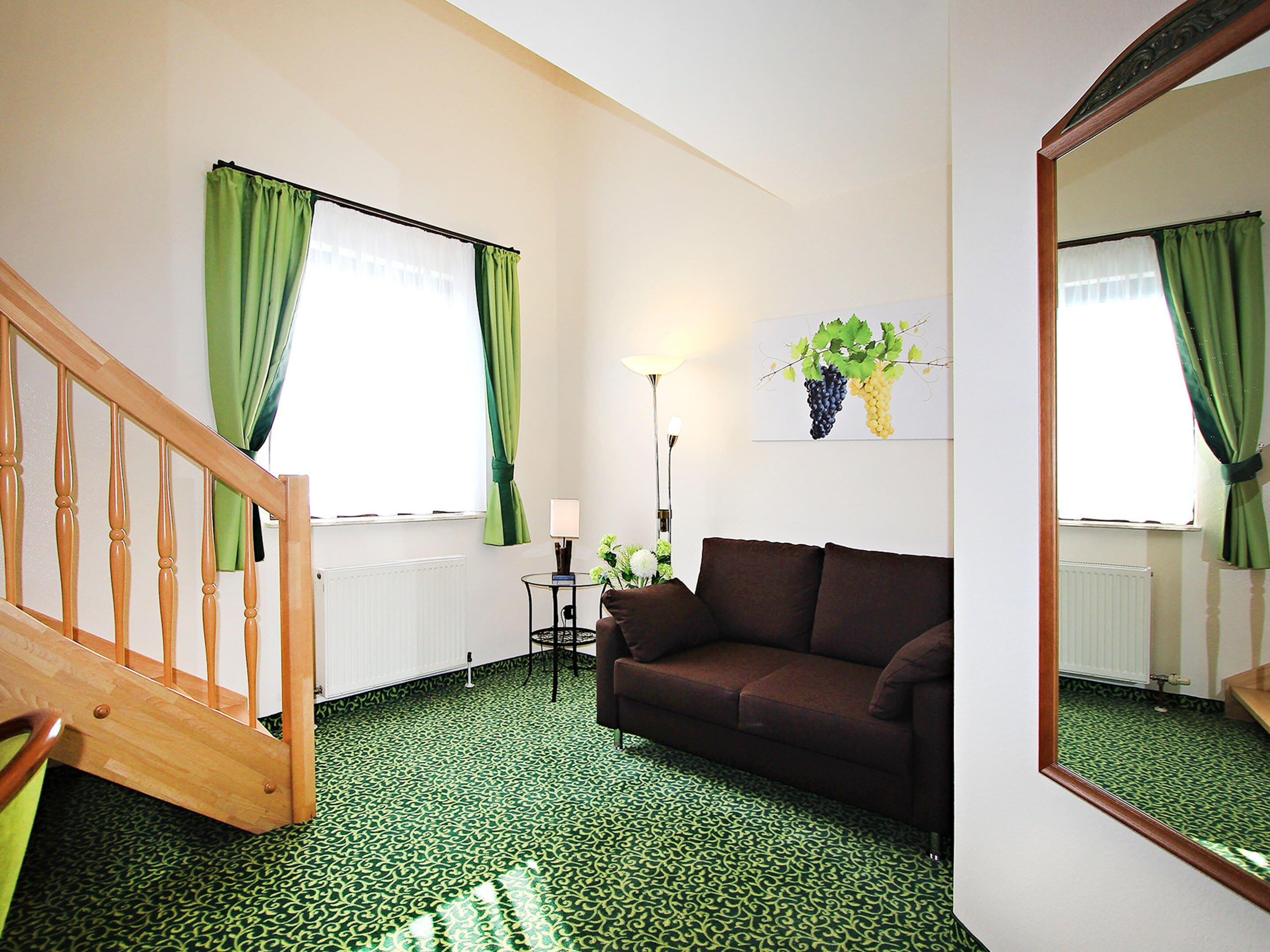 family quadruple room | living area | flat-screen tv