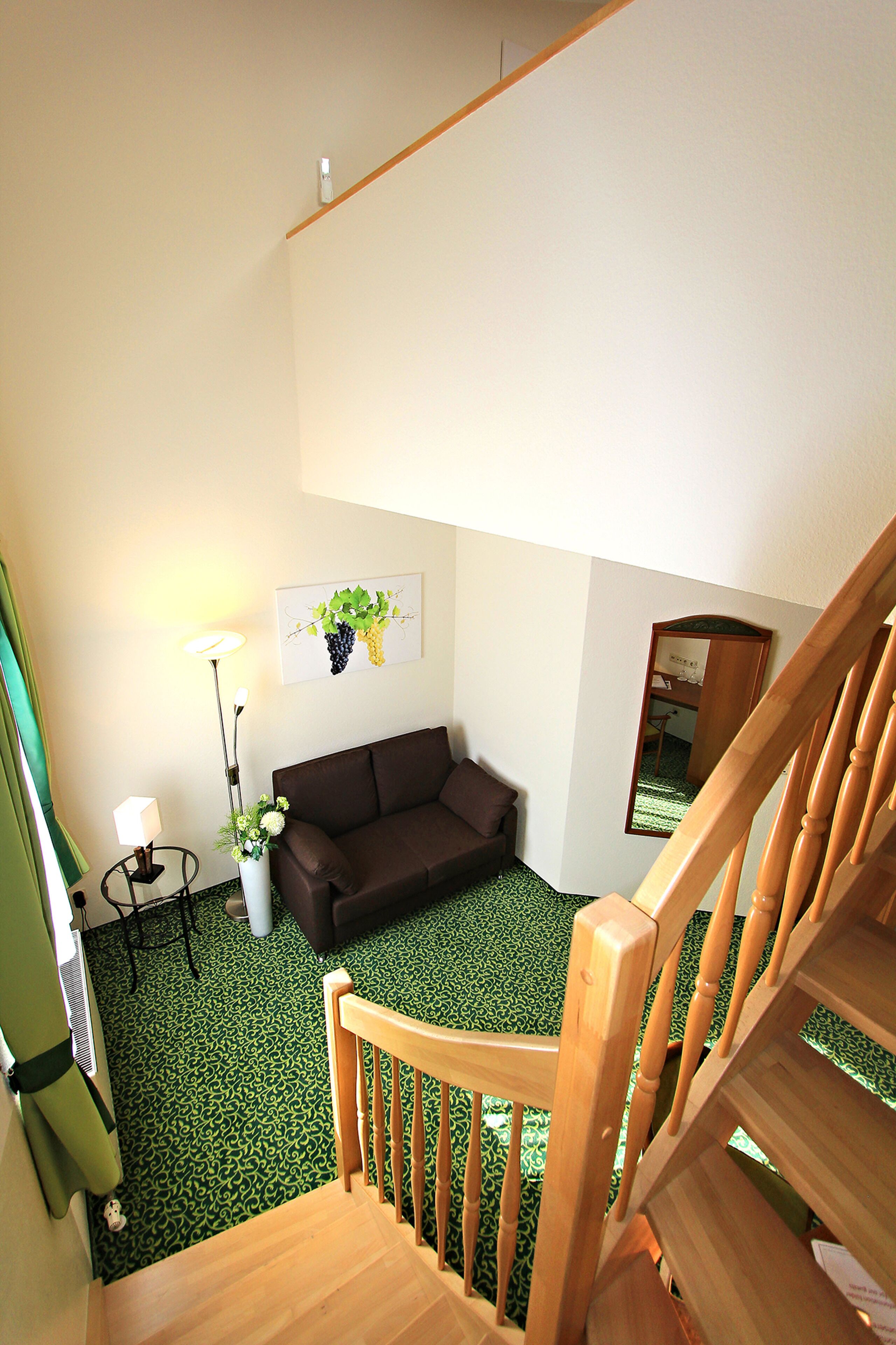 family quadruple room | living area | flat-screen tv