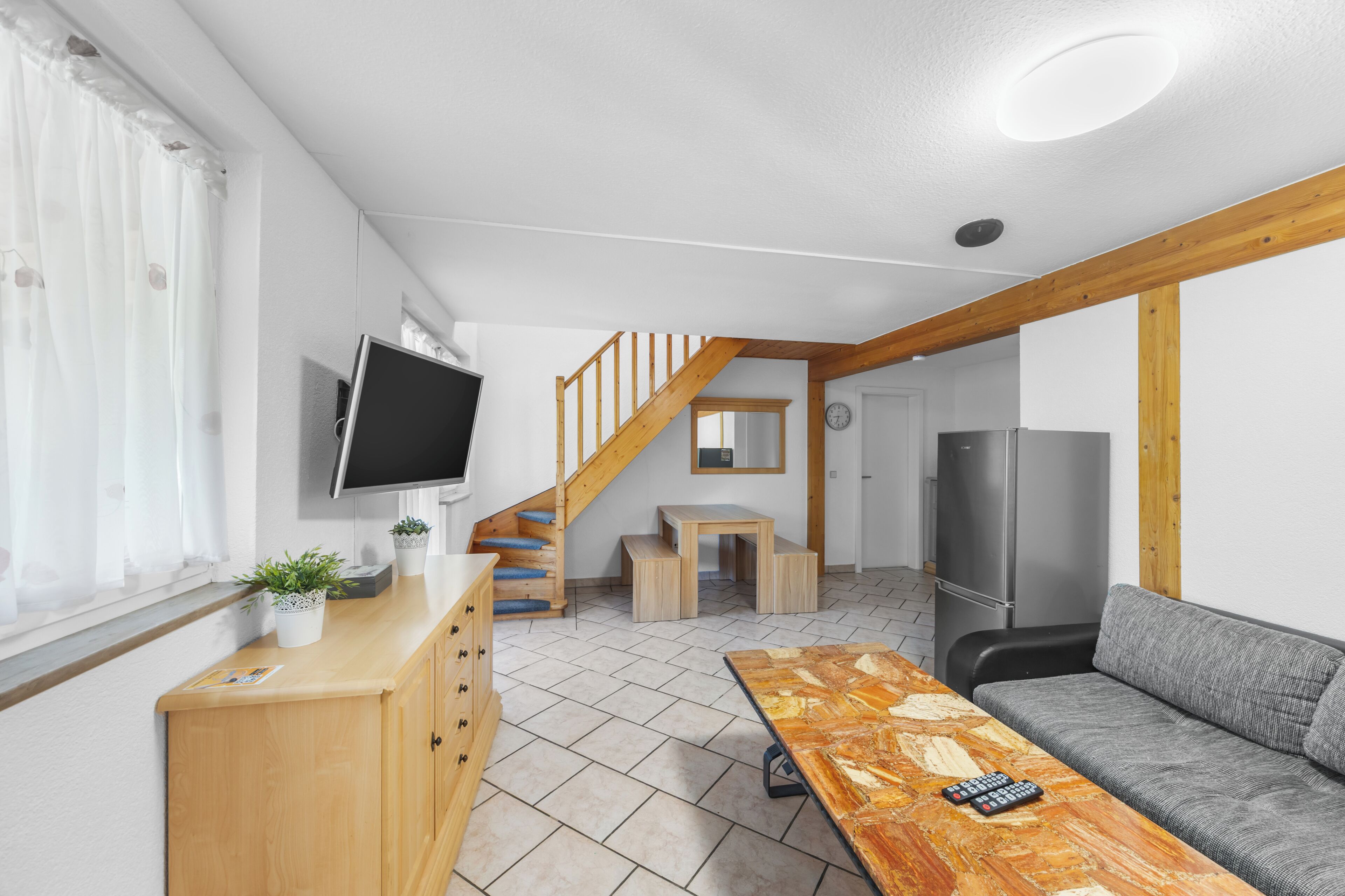 Apartment, 2 Bedrooms | Living area | 32-inch TV with cable channels