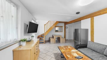 Apartment, 2 Bedrooms | Living area | 32-inch TV with cable channels