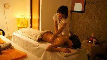 Guests can enjoy a rejuvenating massage on a comfortable table in a serene space.