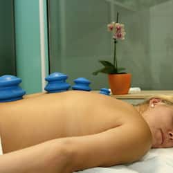 Experience a serene retreat with a massage therapy setup, complete with a bed and soothing ambiance.