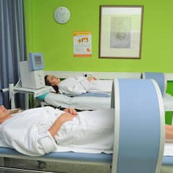 Patients receive care in this well-equipped examination room.