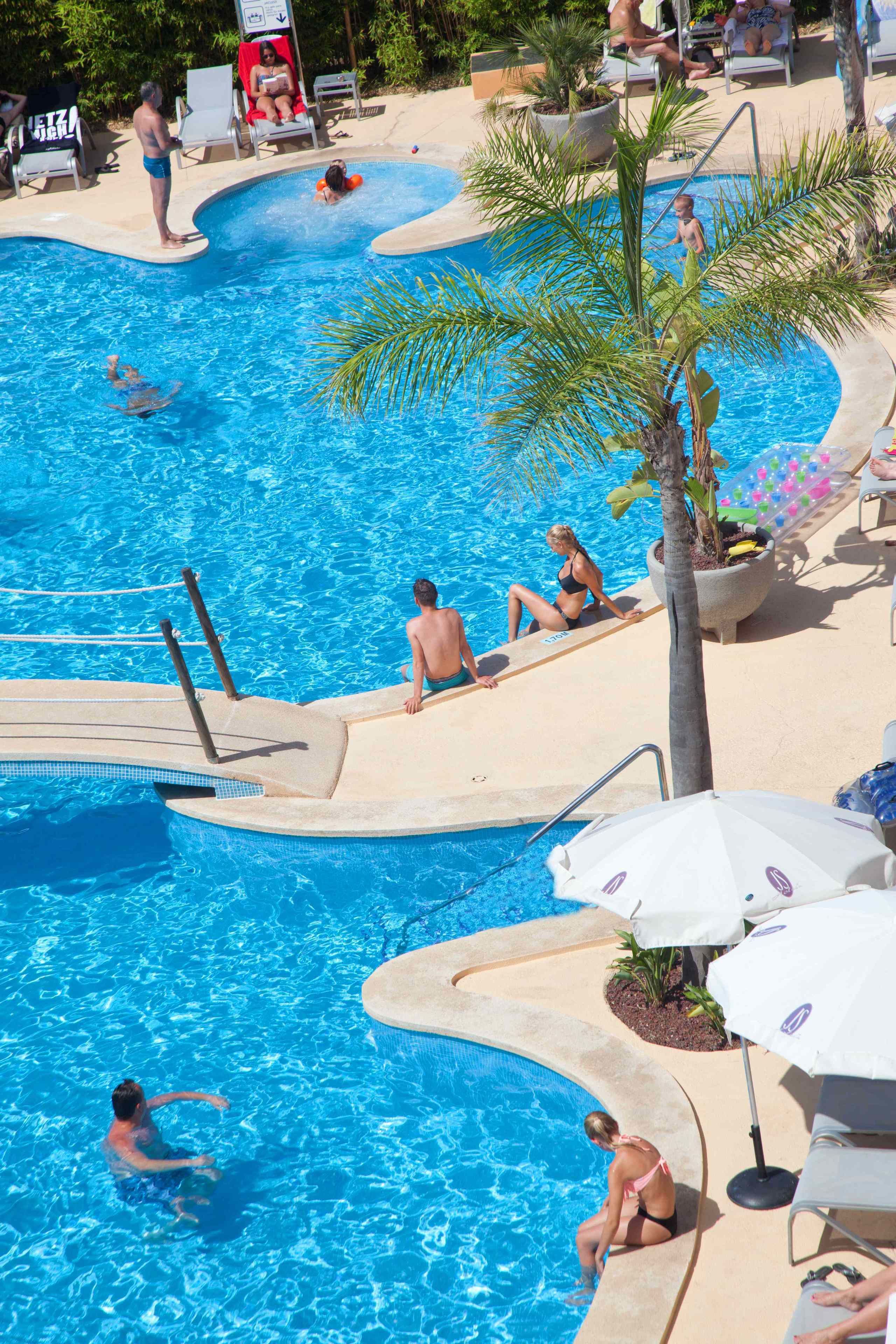 seasonal outdoor pool, pool umbrellas, pool loungers