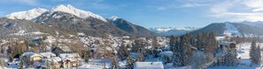 A snow-covered mountain town with houses and buildings.