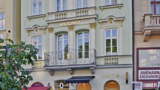 A building with a sign reading "MOZART" and "MARCOAIN" on the facade.