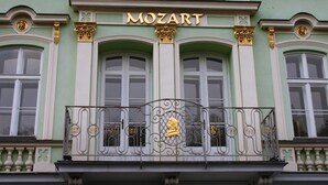 A building facade with the name "MOZART" prominently displayed above the entrance.