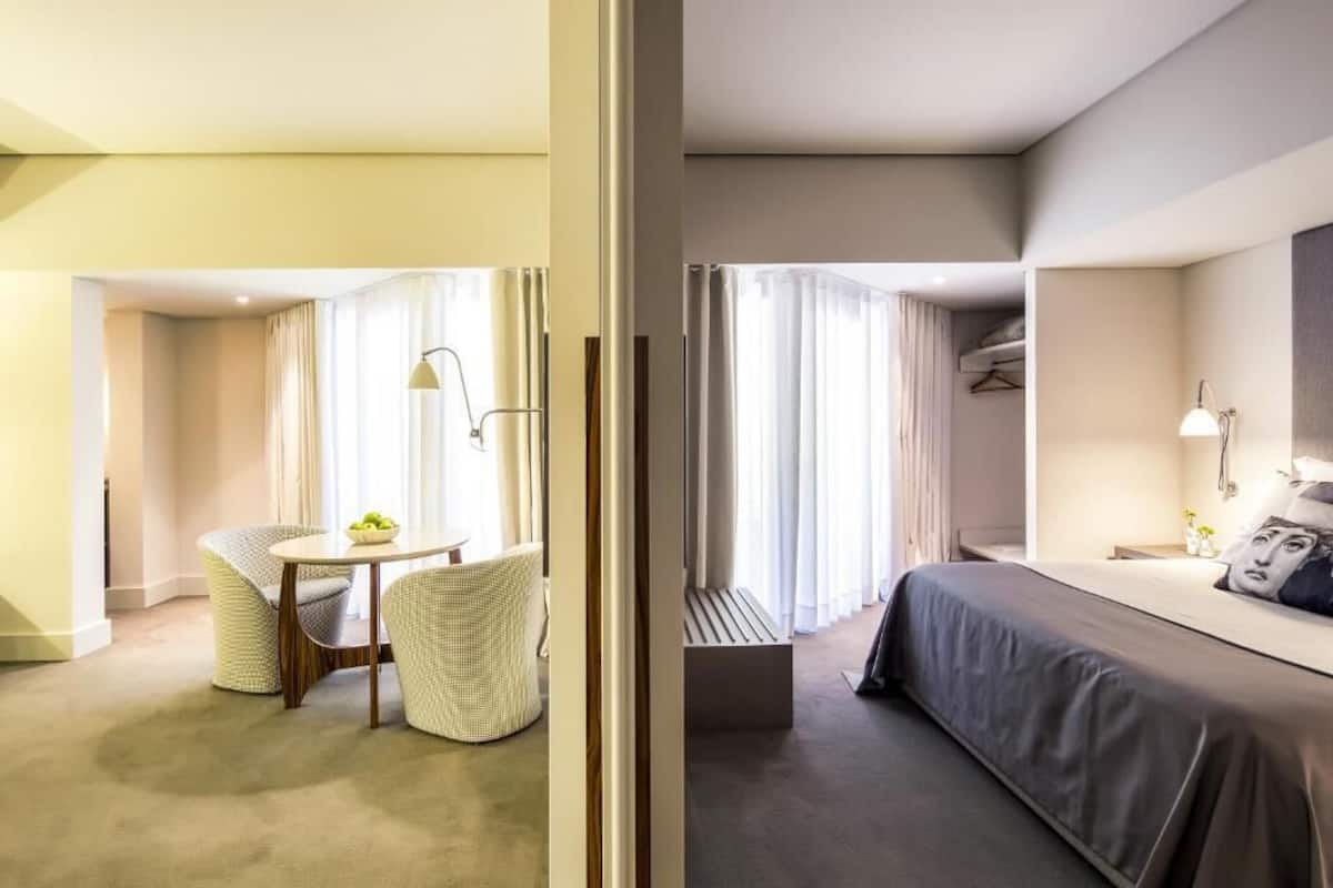 Deluxe Suite | Living area | 60-cm LCD TV with cable channels, TV