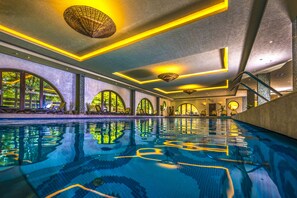 Indoor pool, open 6:00 AM to 9:00 PM, pool loungers