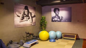Stay active in our fitness room, equipped with a yoga mat, step platform, and exercise balls. Enjoy a motivating workout with the help of our ceiling-mounted projector and air conditioning unit.