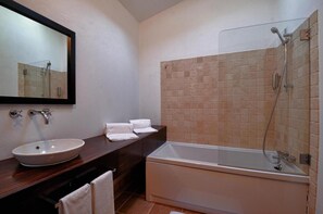 Designer toiletries, hair dryer, bidet, towels