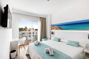 A hotel room with a bed, a desk, a chair, a TV, and a balcony with a view of the sea. - Aluasun Continental Park Hotel & Apartments (Muro)