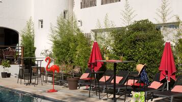 Outdoor pool, open 9:00 AM to 9:00 PM, pool umbrellas, pool loungers