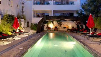 Outdoor pool, open 9:00 AM to 9:00 PM, pool umbrellas, pool loungers