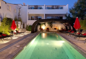 Outdoor pool, open 9:00 AM to 9:00 PM, pool umbrellas, pool loungers