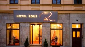A hotel entrance with a sign reading "HOTEL ROUS." - Hotel Rous (Plzen)
