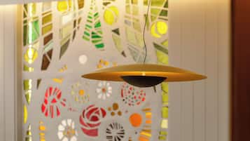 A pendant light fixture with a unique geometric design, suspended from a ceiling.