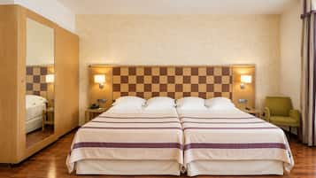 Exclusive Quadruple Room | Premium bedding, down comforters, in-room safe, desk