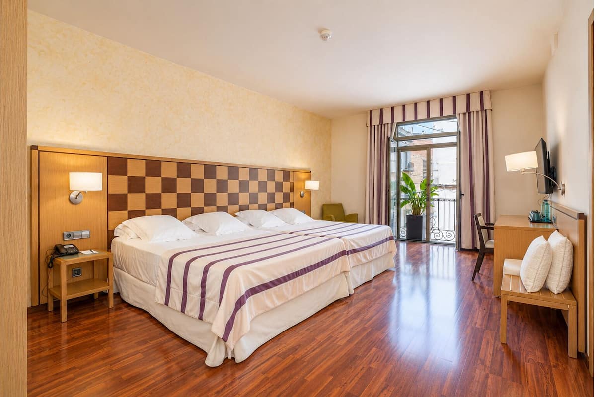 Exclusive Quadruple Room | Premium bedding, down comforters, in-room safe, desk