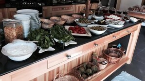 A kitchen counter with various food items and kitchenware. - Misafir Evi Hotel (Fethiye)