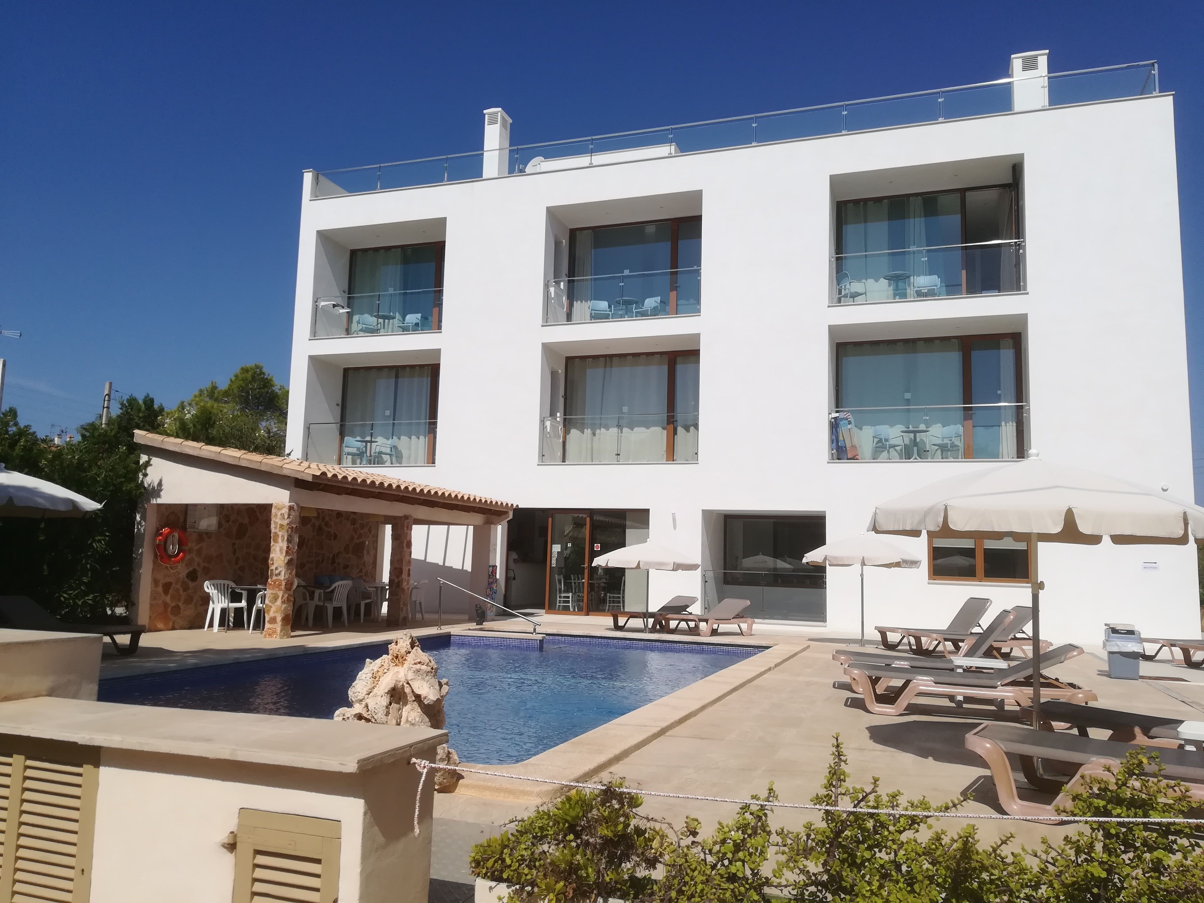 Outdoor pool, open 10:00 AM to 7:00 PM, pool umbrellas, pool loungers