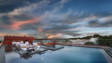 Seasonal outdoor pool, open 8:00 AM to 8:00 PM, pool umbrellas