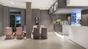 A modern bar area with seating and a bar counter.