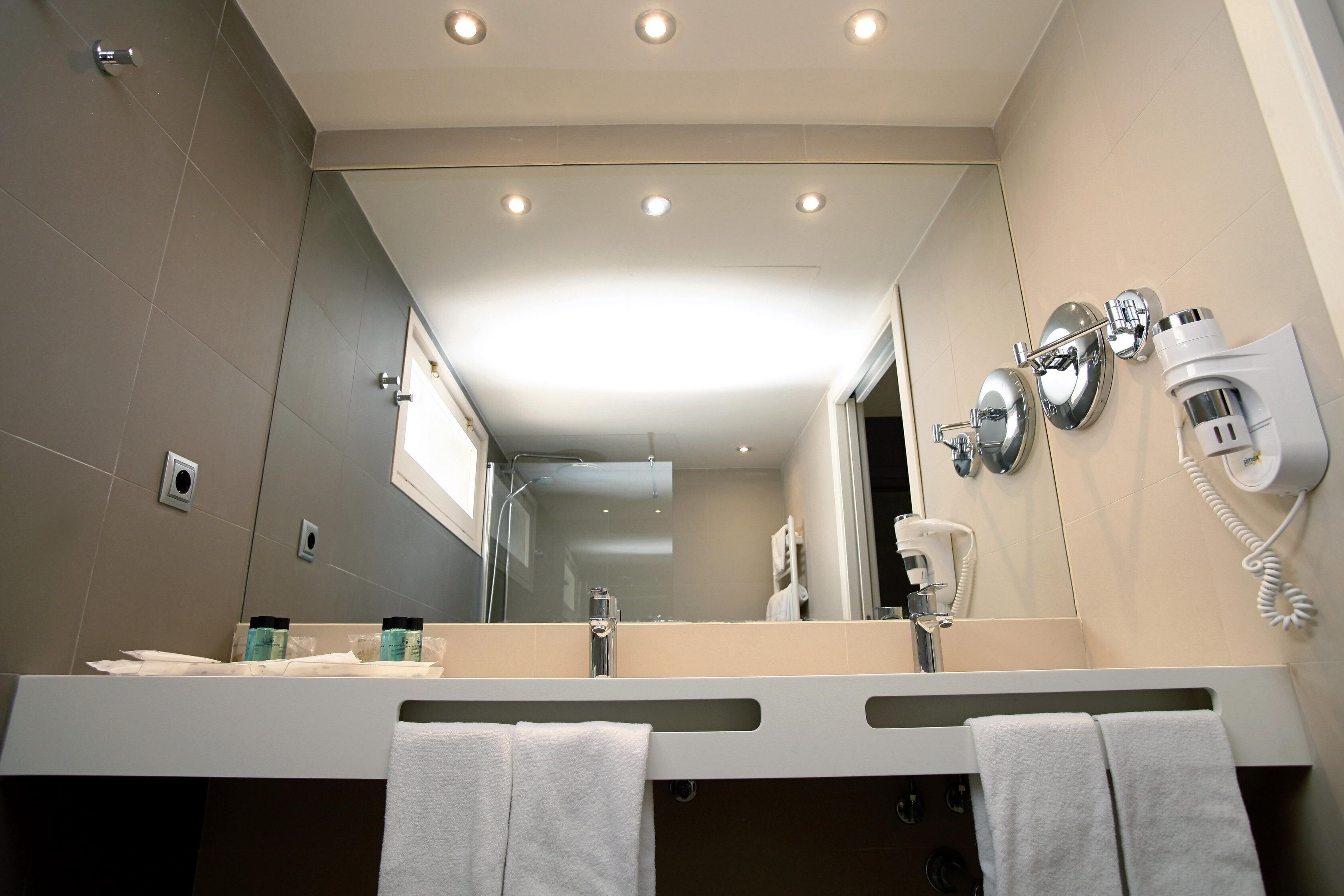 shower, hair dryer, bathrobes, towels